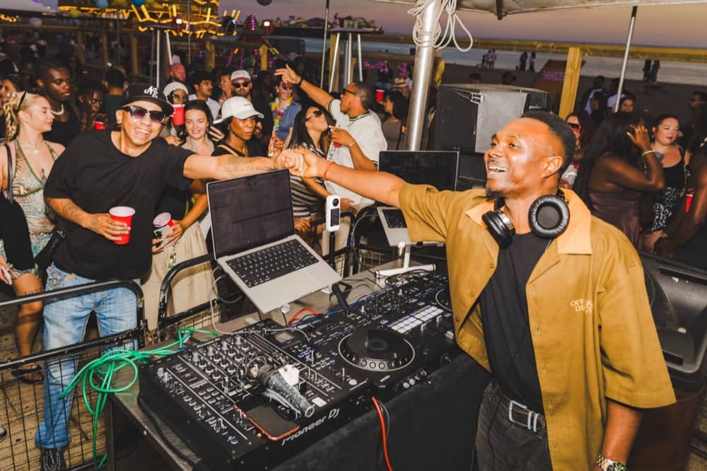 DJ KINGSOL performing to a crowd at a Brighton rooftop event